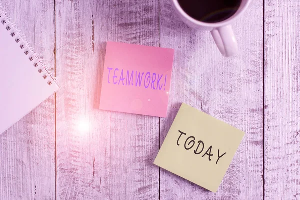 Text sign showing Teamwork. Conceptual photo combined action of group especially when effective and efficient Stationary placed next to a cup of black coffee above the wooden table. — Stock Photo, Image