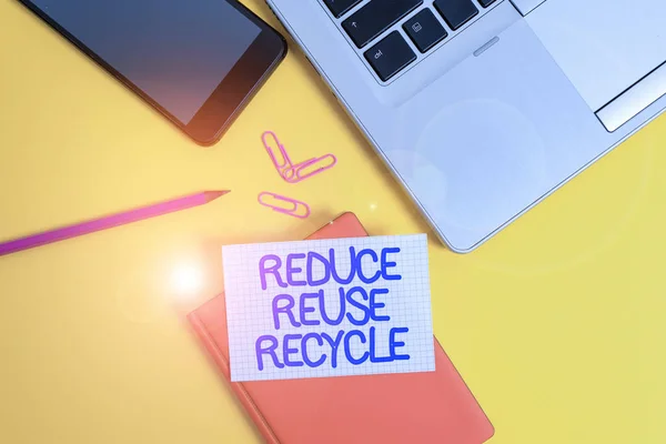 Conceptual hand writing showing Reduce Reuse Recycle. Business photo showcasing environmentallyresponsible consumer behavior Laptop smartphone clip pencil paper sheet colored background. — Stock Photo, Image