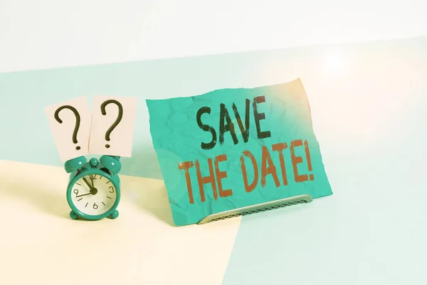 Conceptual hand writing showing Save The Date. Business photo showcasing remember not schedule anything else on this day Alarm clock beside a Paper sheet placed on pastel backdrop. — Stock Photo, Image