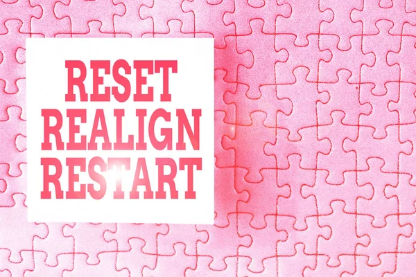 Text sign showing Reset Realign Restart. Conceptual photo Life audit will help you put things in perspectives Piece of square note paper use for give notation stick to puzzle background.