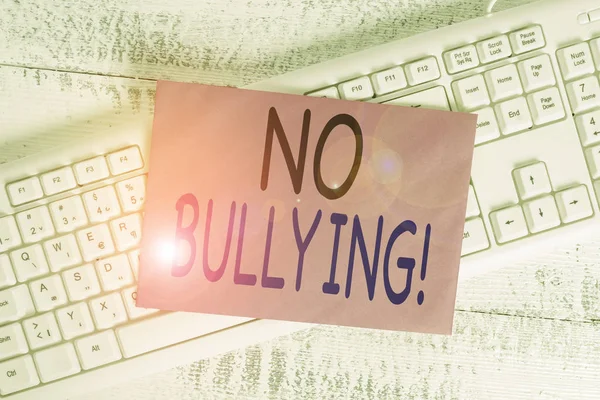 Word writing text No Bullying. Business concept for stop aggressive behavior among children power imbalance White keyboard office supplies empty rectangle shaped paper reminder wood. — Stock Photo, Image