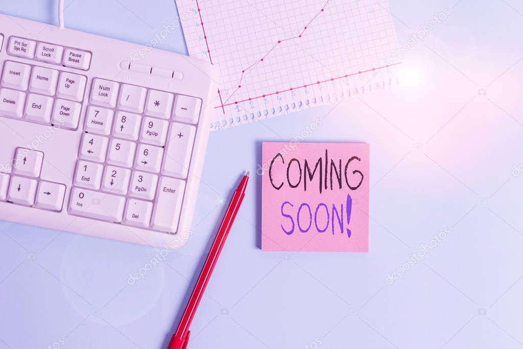 Writing note showing Coming Soon. Business photo showcasing event or action that will happen after really short time Paper blue keyboard office study notebook chart numbers memo.
