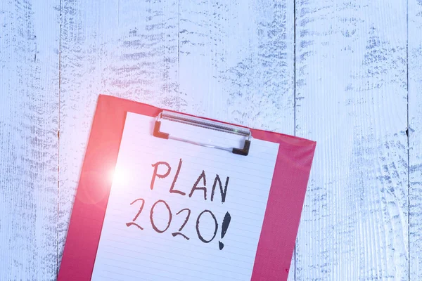 Word writing text Plan 2020. Business concept for detailed proposal doing achieving something next year Colored clipboard blank paper sheet old retro wooden vintage background. — 图库照片