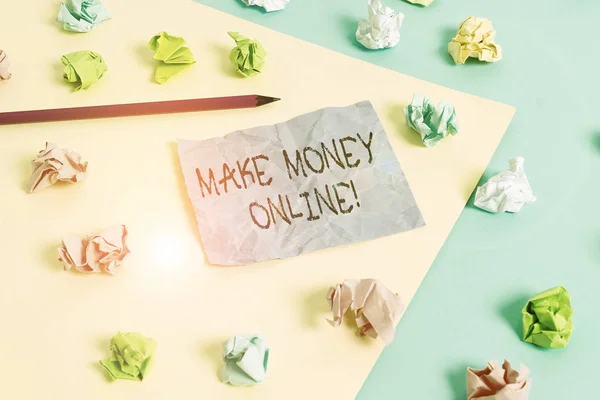 Writing note showing Make Money Online. Business photo showcasing making profit using internet like freelancing or marketing Colored crumpled papers empty reminder blue yellow clothespin.
