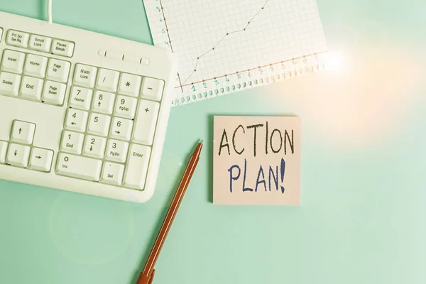 Writing note showing Action Plan. Business photo showcasing proposed strategy or course of actions for certain time Paper blue keyboard office study notebook chart numbers memo.