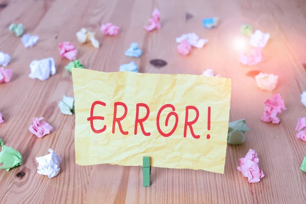 Writing note showing Error. Business photo showcasing state or condition of being wrong in conduct judgement or program Colored crumpled papers wooden floor background clothespin. — Stock Photo, Image