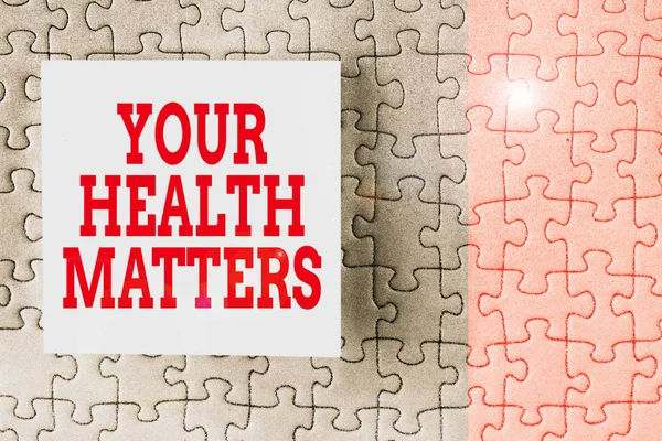 Text sign showing Your Health Matters. Conceptual photo good health is most important among other things Piece of square note paper use for give notation stick to puzzle background.