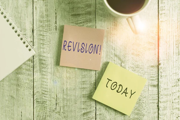 Text sign showing Revision. Conceptual photo action of revising over someone like auditing or accounting Stationary placed next to a cup of black coffee above the wooden table.