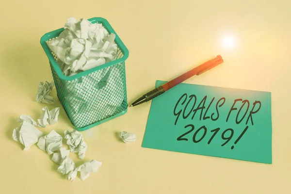 Handwriting text writing Goals For 2019. Concept meaning object of demonstratings ambition or effort aim or desired result crumpled paper trash and stationary with note paper placed in the trash can.