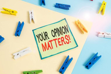 Conceptual hand writing showing Your Opinion Matters. Business photo showcasing show you do not agree with something that just been said Colored clothespin paper reminder with yellowblue background.