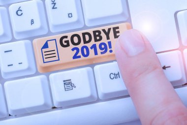 Godbye 2019 'u gösteren bir not yazıyorum. İş fotoğrafı gösterimi ayrılırken veya geçen yılın sonunda iyi dileklerini iletiyor..