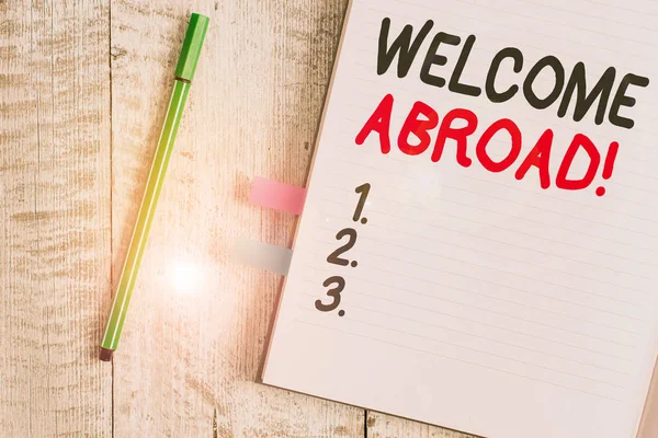Word writing text Welcome Abroad. Business concept for something that you say when someone gets on ship Thick pages notebook stationary placed above classic look wooden backdrop. — Stock Photo, Image