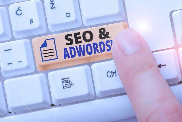 Writing note showing Seo And Adwords. Business photo showcasing they are main tools components of Search Engine Marketing. — Stock Photo, Image