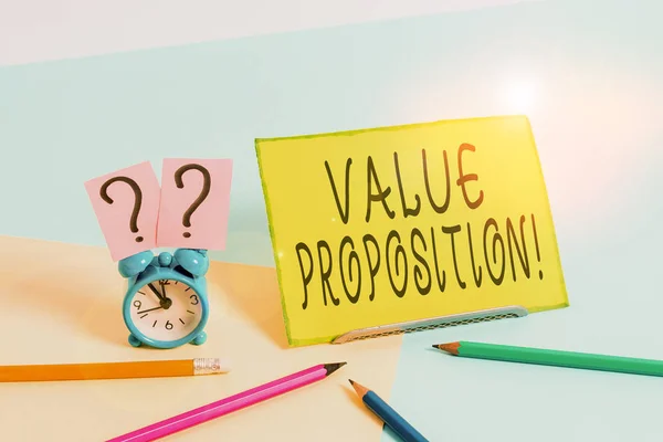 Conceptual hand writing showing Value Proposition. Business photo text innovation service intended make product attractive Mini size alarm clock beside stationary on pastel backdrop. — Stock Photo, Image