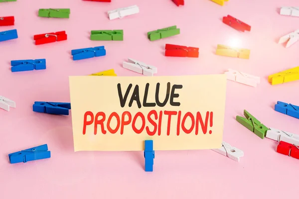 Conceptual hand writing showing Value Proposition. Business photo showcasing innovation service intended make product attractive Colored clothespin papers empty reminder pink floor office. — Stock Photo, Image