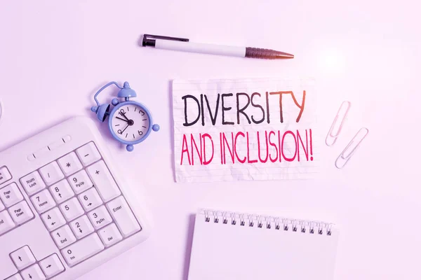 Conceptual hand writing showing Diversity And Inclusion. Business photo showcasing range huanalysis difference includes race ethnicity gender Copy space on note paper with clock and pencil on the tabl
