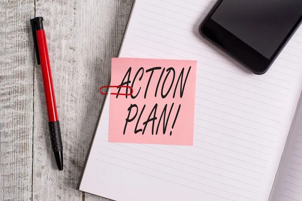Handwriting text writing Action Plan. Concept meaning proposed strategy or course of actions for certain time Thick pages notebook stationary placed above classic look wooden backdrop. — Stock Photo, Image