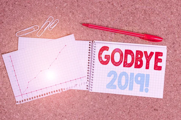 Writing note showing Godbye 2019. Business photo showcasing express good wishes when parting or at the end of last year Desk notebook paper office paperboard study supplies chart.