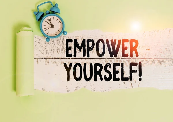 Writing note showing Empower Yourself. Business photo showcasing taking control of our life setting goals and making choices Alarm clock and torn cardboard on a wooden classic table backdrop. — Stock Photo, Image