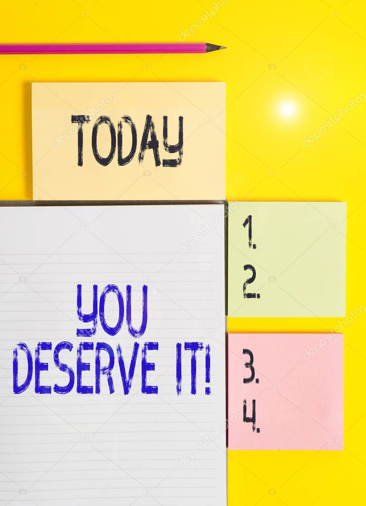 Handwriting text You Deserve It. Concept meaning should have it because of their qualities or actions Colored empty papers with copy space on the yellow background table.