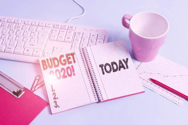 Handwriting text writing Budget 2020. Concept meaning estimate of income and expenditure for next or current year Paper blue desk computer keyboard office study notebook chart numbers memo.