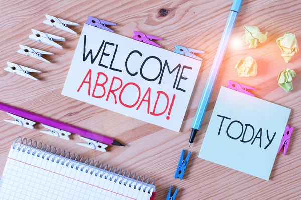 Word writing text Welcome Abroad. Business concept for something that you say when someone gets on ship Colored clothespin papers empty reminder wooden floor background office. — Stock Photo, Image