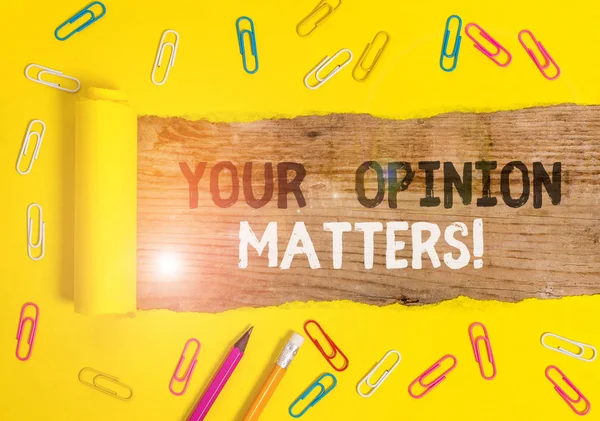 Handwriting text writing Your Opinion Matters. Concept meaning show you do not agree with something that just been said Stationary and torn cardboard placed above a wooden classic table backdrop.