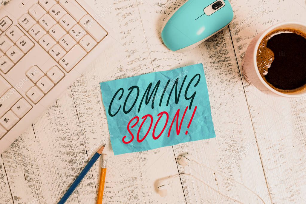 Handwriting text writing Coming Soon. Conceptual photo event or action that will happen after really short time technological devices colored reminder paper office supplies keyboard mouse