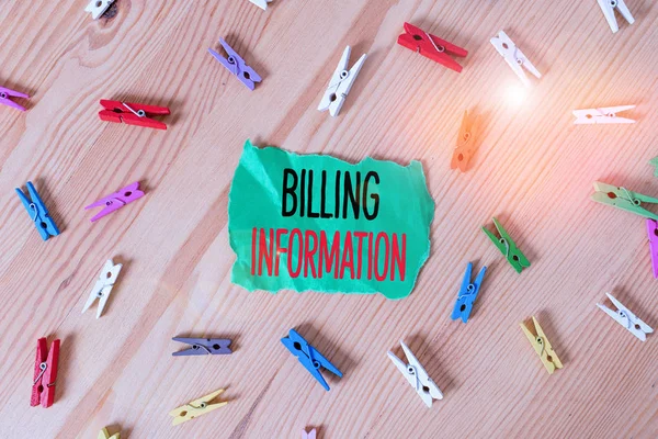 Conceptual hand writing showing Billing Information. Business photo showcasing address connected to a specific form of payment Colored crumpled papers wooden floor background clothespin.