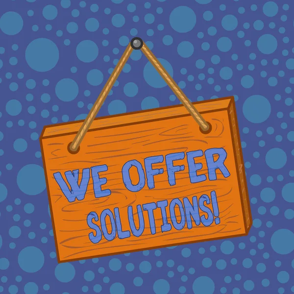 Word writing text We Offer Solutions. Business concept for Offering help assistance Experts advice strategies ideas Square rectangle unreal cartoon wood wooden hang down on the coloured wall.