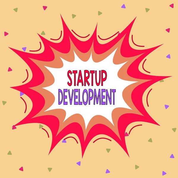 Writing note showing Startup Development. Business photo showcasing efficiently develop and validate scalable business model Asymmetrical uneven shaped pattern object multicolour design. — 图库照片