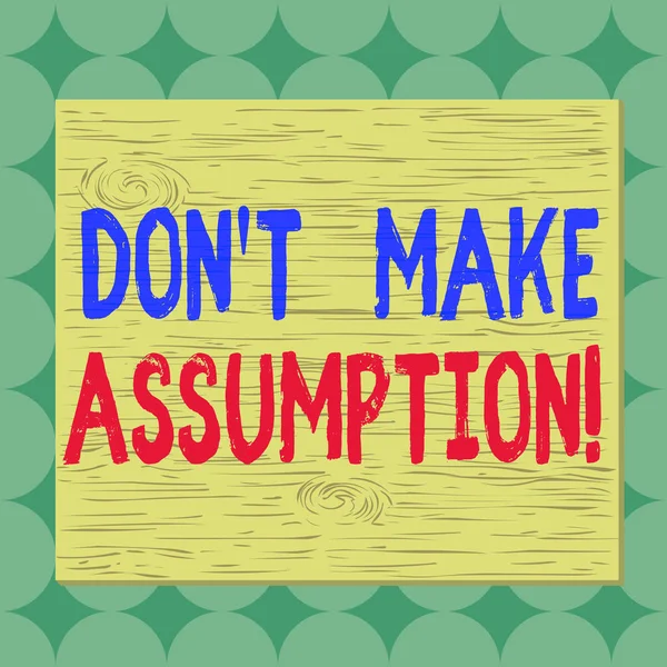 Conceptual hand writing showing Don T Make Assumption. Business photo showcasing something that you assume to be case even without proof Square rectangle unreal cartoon wood on the coloured wall. — Stock Photo, Image
