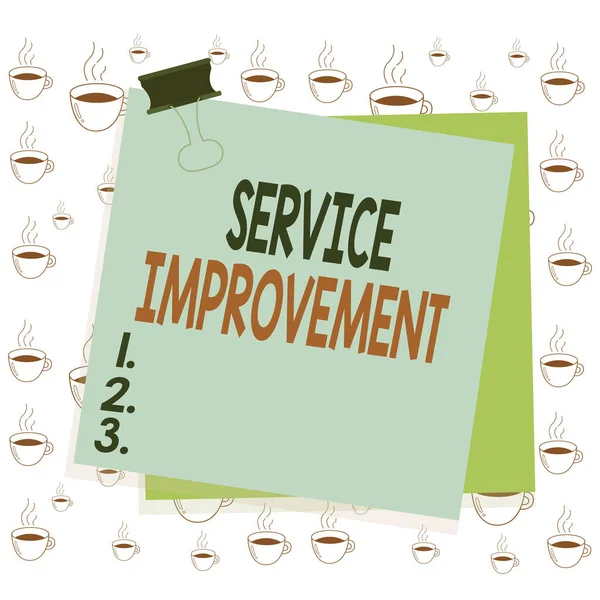 Writing note showing Service Improvement. Business photo showcasing continuous actions that lead to better service or system Paper stuck binder clip colorful background reminder memo office supply.