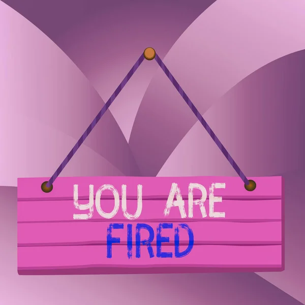 Handwriting text You Are Fired. Concept meaning Getting out from the job and become jobless not end the career Wood plank nail pin string board colorful background wooden panel fixed.