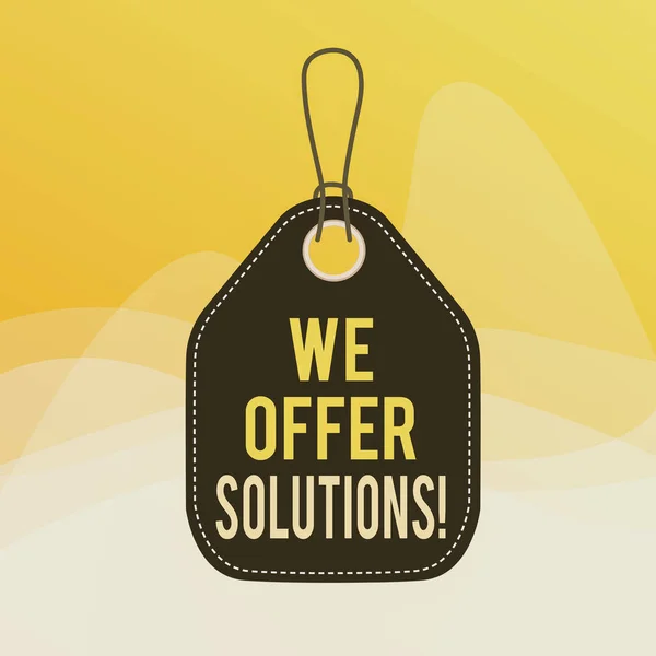 Conceptual hand writing showing We Offer Solutions. Business photo showcasing Offering help assistance Experts advice strategies ideas Empty tag colorful background label rectangle attach string.