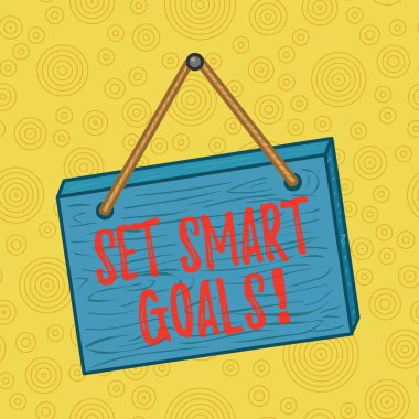 El yazısı yazıları Akıllı Hedefler Ayarla. Fikirlerinizi netleştirmek için anlam listesi yapın. Odaklanma çabalarınızı netleştirmek için zamanı bilgece kare dikdörtgenler gerçek dışı tahta karikatürler kullanın. Renkli duvara asılı ahşap..