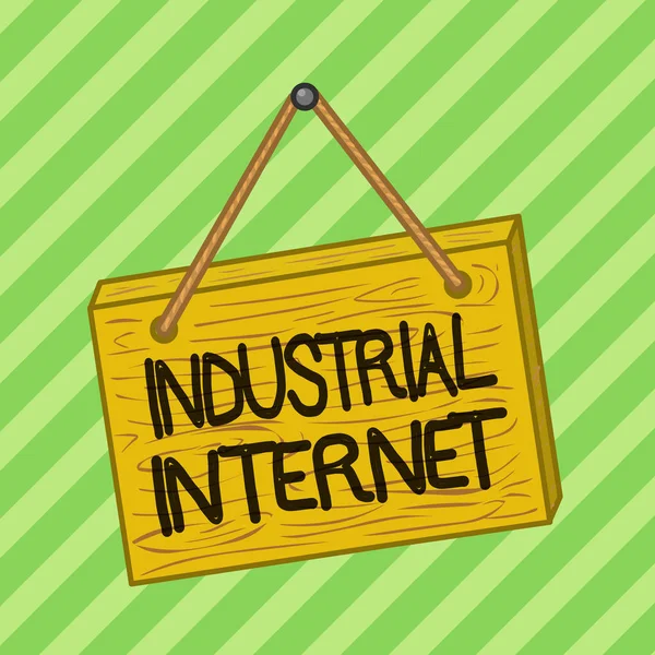 Text sign showing Industrial Internet. Conceptual photo use of the internet of things in industrial sectors Square rectangle unreal cartoon wood wooden hang down on the coloured wall.