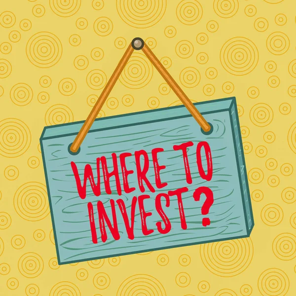 Handwriting text writing Where To Invest Question. Concept meaning asking about where put money into financial schemes or shares Square rectangle unreal cartoon wood wooden hang down on the coloured w — Stock Photo, Image