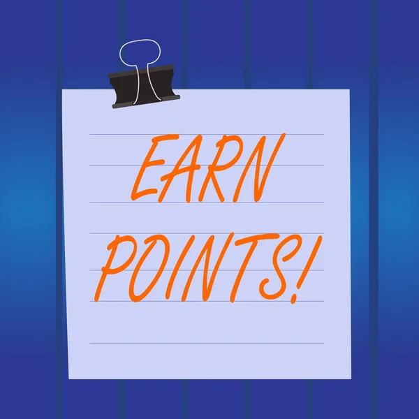 Writing note showing Earn Points. Business photo showcasing collecting scores in order qualify to win big prize Paper lines binder clip suare notebook color background.