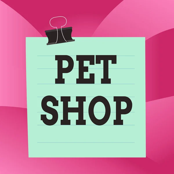 Handwriting text Pet Shop. Concept meaning Retail business that sells different kinds of animals to the public Paper lines binder clip cardboard blank square notebook color background. — Stock Photo, Image