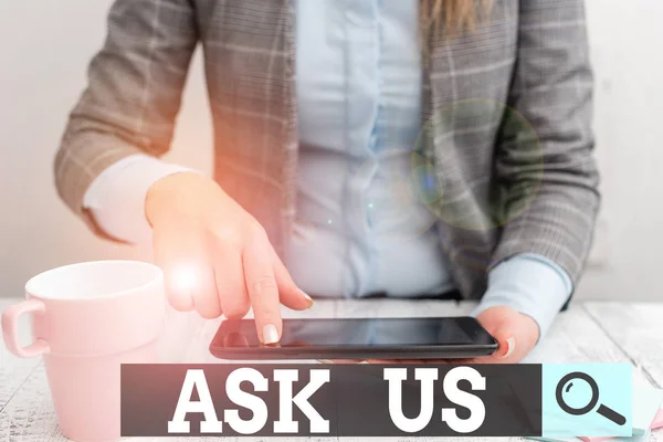 Word writing text Ask Us. Business concept for accepting questions or inquiry from showing Will answers any doubts Business woman sitting with mobile phone and cup of coffee on the table.