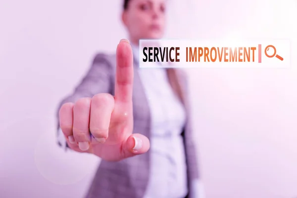 Conceptual hand writing showing Service Improvement. Business photo showcasing continuous actions that lead to better service or system Digital business concept with business woman.