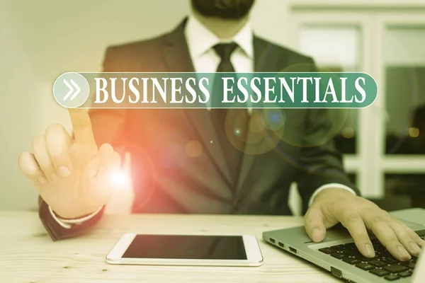 Writing note showing Business Essentials. Business photo showcasing important key ideas to improve business skills Male human wear formal clothes present use hitech smartphone. — Stock Photo, Image