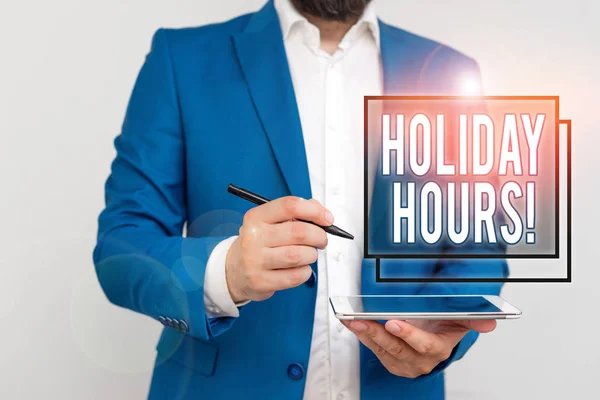 Handwriting text writing Holiday Hours. Concept meaning Overtime work on for employees under flexible work schedules Businessman with pointing finger in front of him.