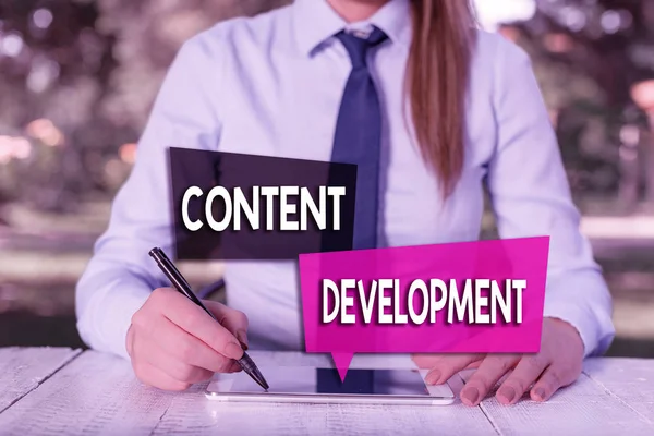 Handwriting text Content Development. Concept meaning Authoring and originating content for any medium Female business person sitting by table and holding mobile phone.