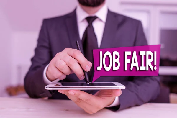 Text sign showing Job Fair. Conceptual photo event in which employers recruiters give information to employees Male human wear formal clothes present presentation use hi tech smartphone.