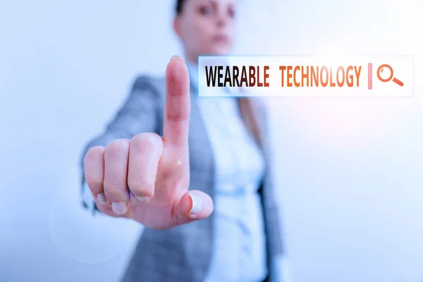 Conceptual hand writing showing Wearable Technology. Business photo showcasing electronic devices that can be worn as accessories Digital business concept with business woman.