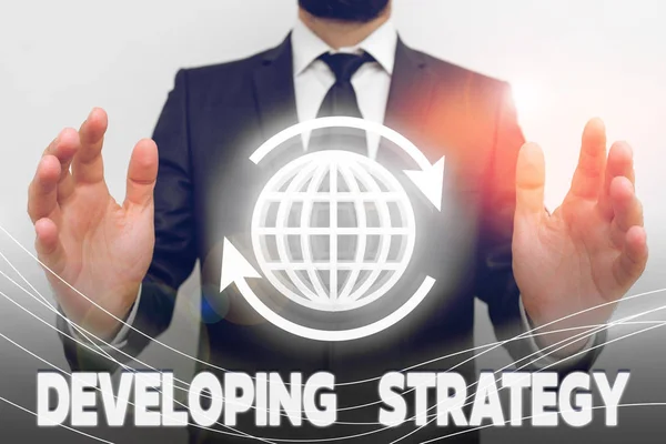 Text sign showing Developing Strategy. Conceptual photo Game plan that sets specific goals and objectives. — Stock Photo, Image