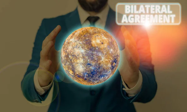 Conceptual hand writing showing Bilateral Agreement. Business photo showcasing Legal obligations to nonbinding agreements of principle Elements of this image furnished by NASA. — Stock Photo, Image