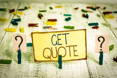 Word writing text Get Quote. Business concept for the most recent price to which a buyer and seller agreed Scribbled and crumbling sheet with paper clips placed on the wooden table.